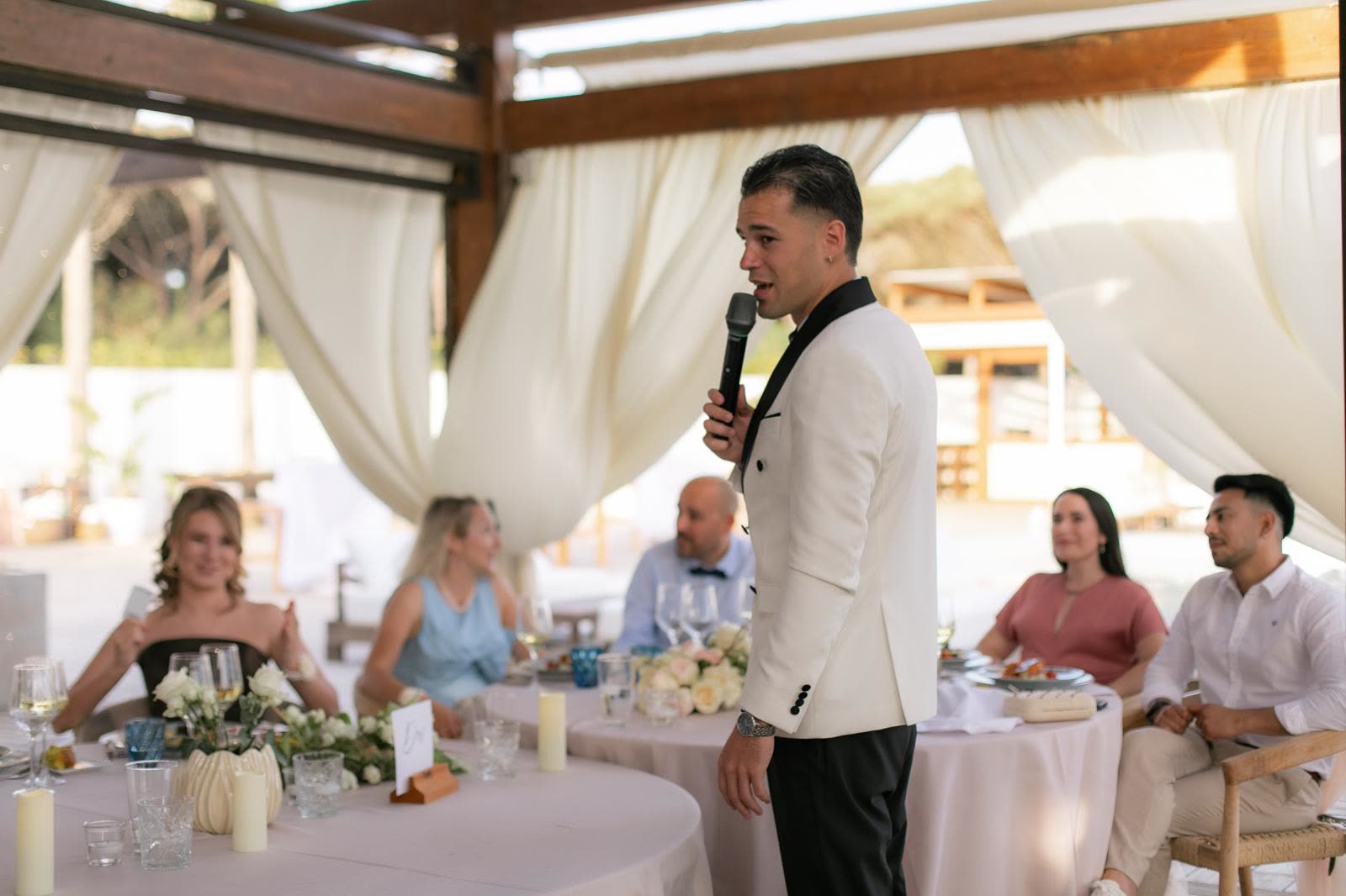 Vova speaking among guests at Ekaterina and Nikita's wedding in Cadiz