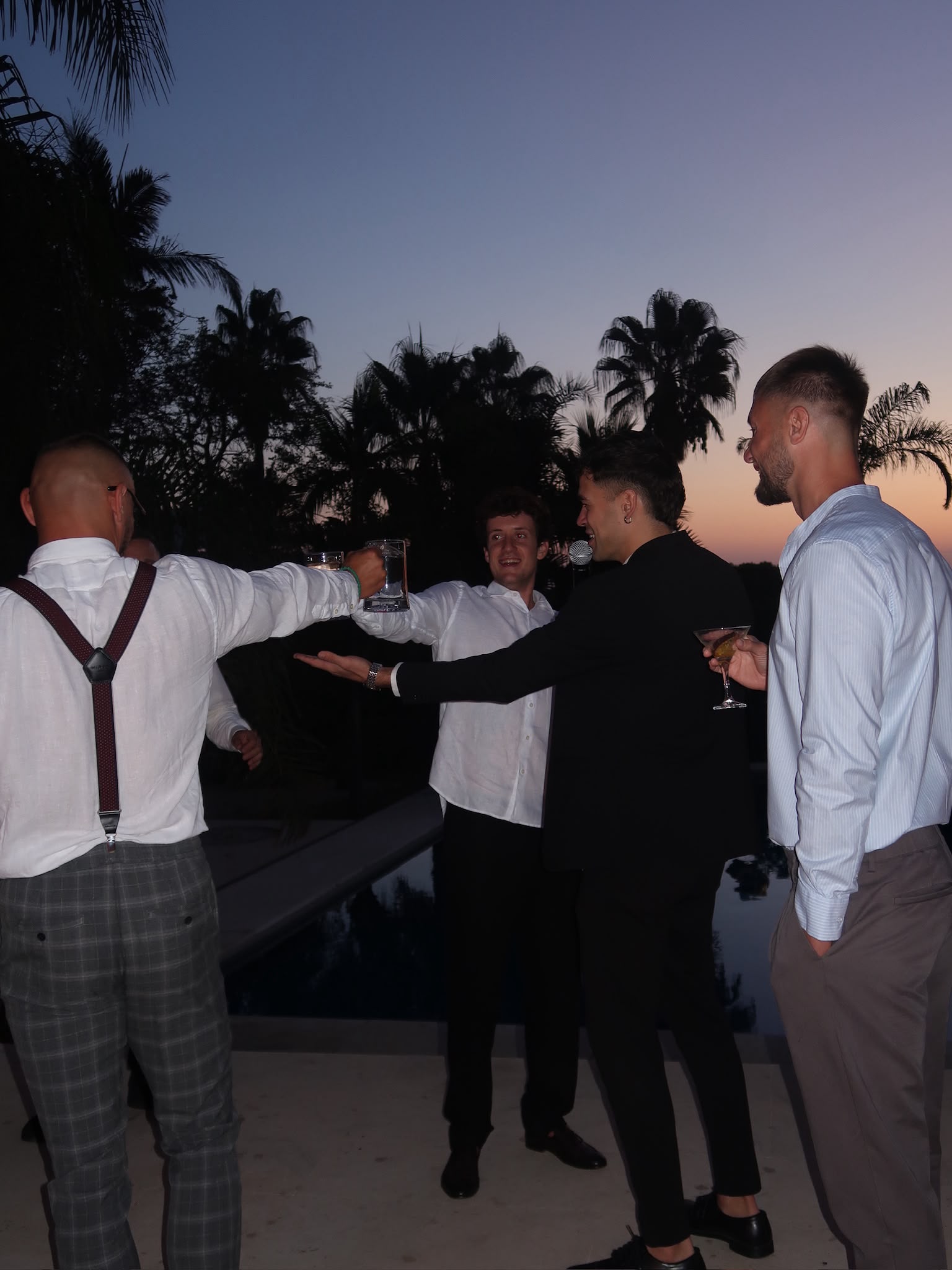 Vova leading a game among birthday guests at sunset